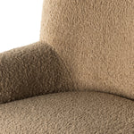 Simply classic. The Kadon Swivel Chair features a high wing back and pairs with softly rolled arms for a curvy look and supportive sit. Camel-colored shearling-upholstered seating tops a 360-degree swivel for total modernity. Amethyst Home provides interior design, new home construction design consulting, vintage area rugs, and lighting in the Dallas metro area.