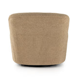 Simply classic. The Kadon Swivel Chair features a high wing back and pairs with softly rolled arms for a curvy look and supportive sit. Camel-colored shearling-upholstered seating tops a 360-degree swivel for total modernity. Amethyst Home provides interior design, new home construction design consulting, vintage area rugs, and lighting in the Des Moines metro area.