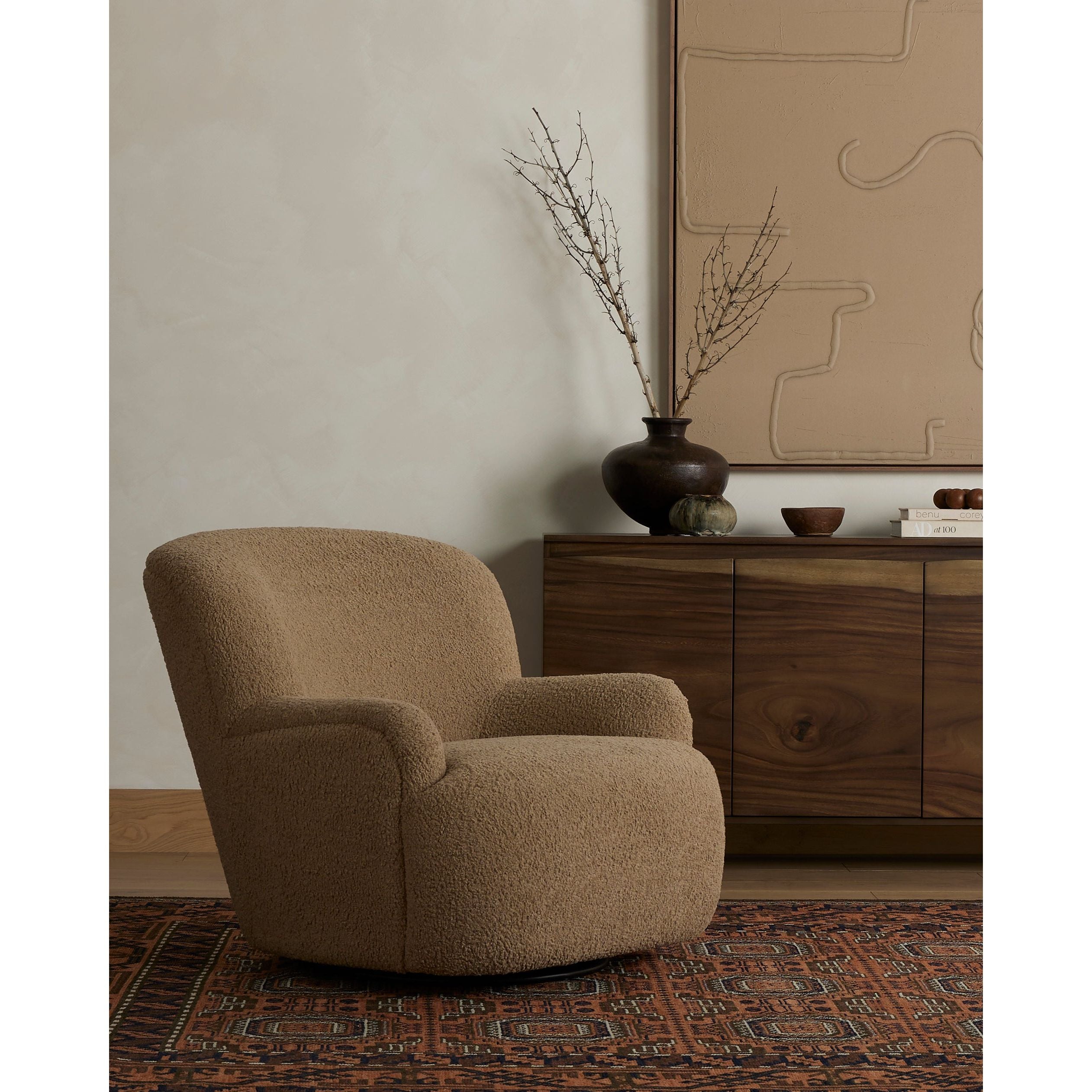 Simply classic. The Kadon Swivel Chair features a high wing back and pairs with softly rolled arms for a curvy look and supportive sit. Camel-colored shearling-upholstered seating tops a 360-degree swivel for total modernity. Amethyst Home provides interior design, new home construction design consulting, vintage area rugs, and lighting in the Nashville metro area.