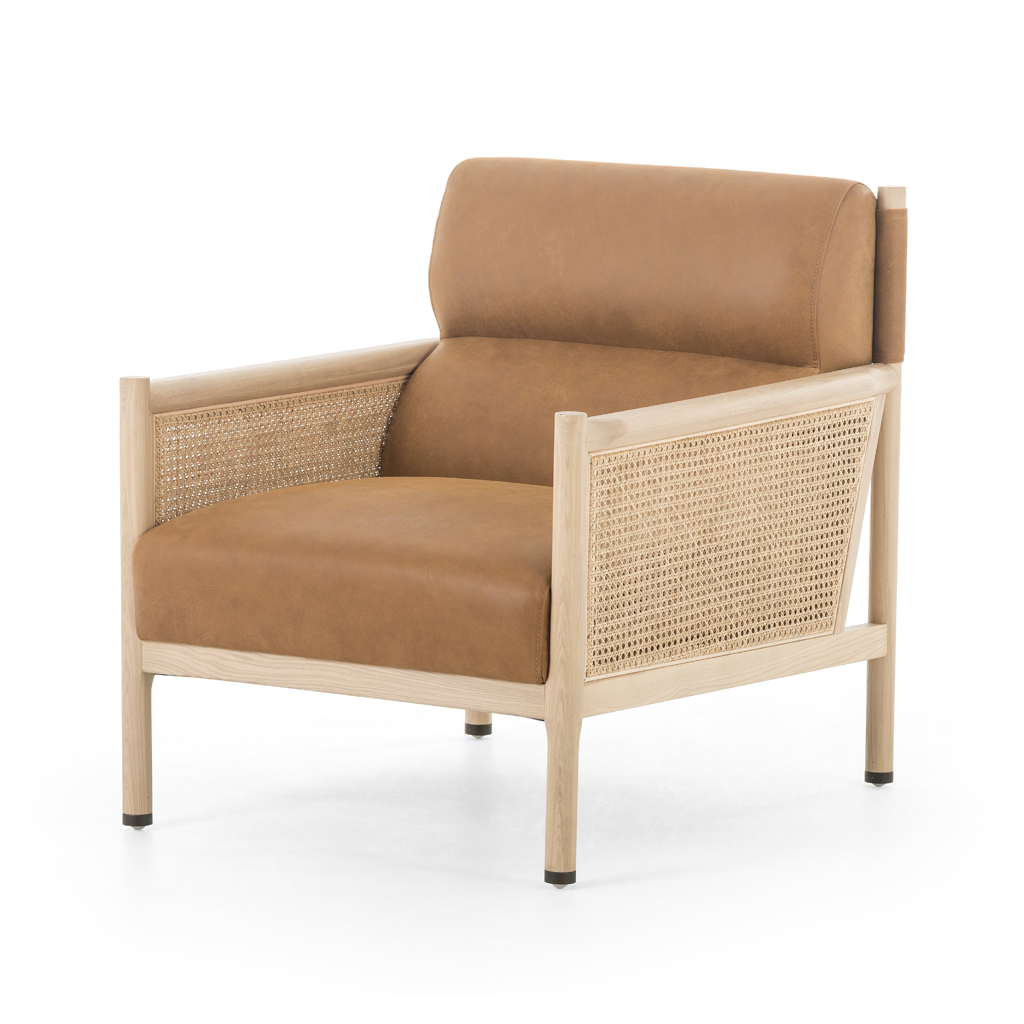 Craft a Parisian vibe with French-inspired seating. Covered in supple, top-grain leather in an heirloom black hue, the seating is perfectly positioned for comfort, with ash framing and woven sides of natural cane. Amethyst Home provides interior design, new home construction design consulting, vintage area rugs, and lighting in the Tampa metro area.