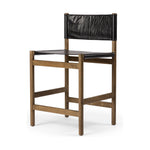 Solid parawood forms a simple, vintage-inspired frame for sling-style seating of black top-grain leather exclusive to Four Hands. Perfectly sized for the counter. Amethyst Home provides interior design, new construction, custom furniture, and area rugs in the Los Angeles metro area.