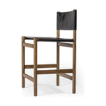 Solid parawood forms a simple, vintage-inspired frame for sling-style seating of black top-grain leather exclusive to Four Hands. Perfectly sized for the counter. Amethyst Home provides interior design, new construction, custom furniture, and area rugs in the Newport Beach metro area.