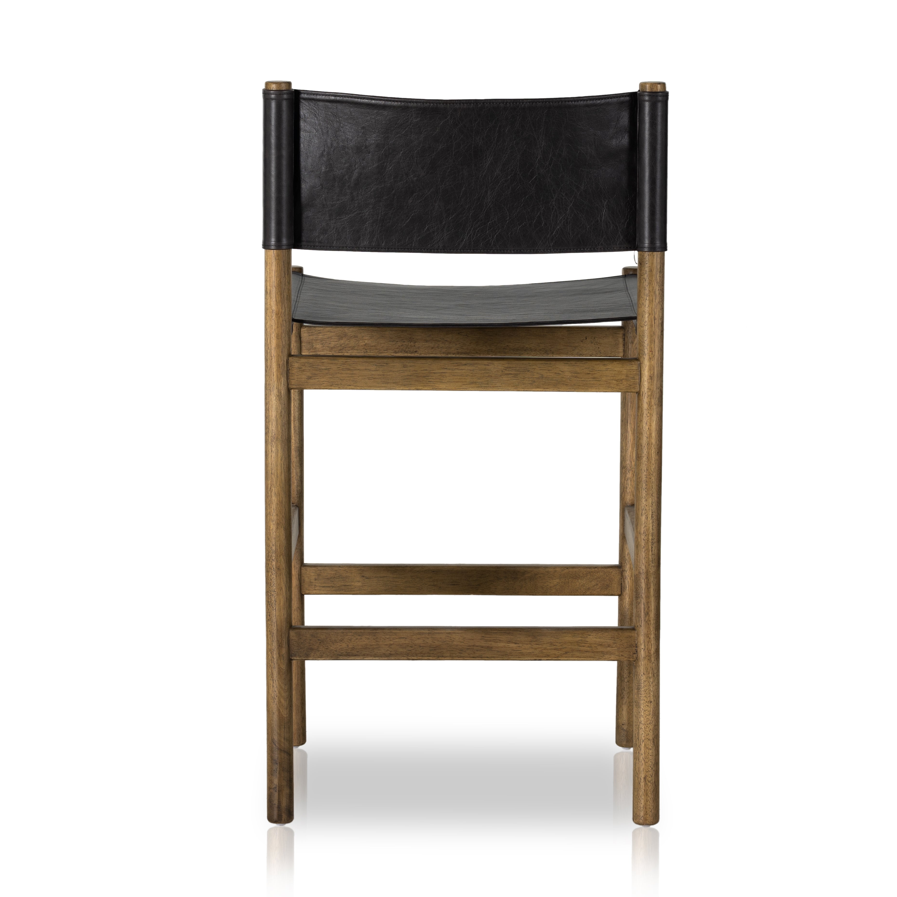 Solid parawood forms a simple, vintage-inspired frame for sling-style seating of black top-grain leather exclusive to Four Hands. Perfectly sized for the counter. Amethyst Home provides interior design, new construction, custom furniture, and area rugs in the Portland metro area.