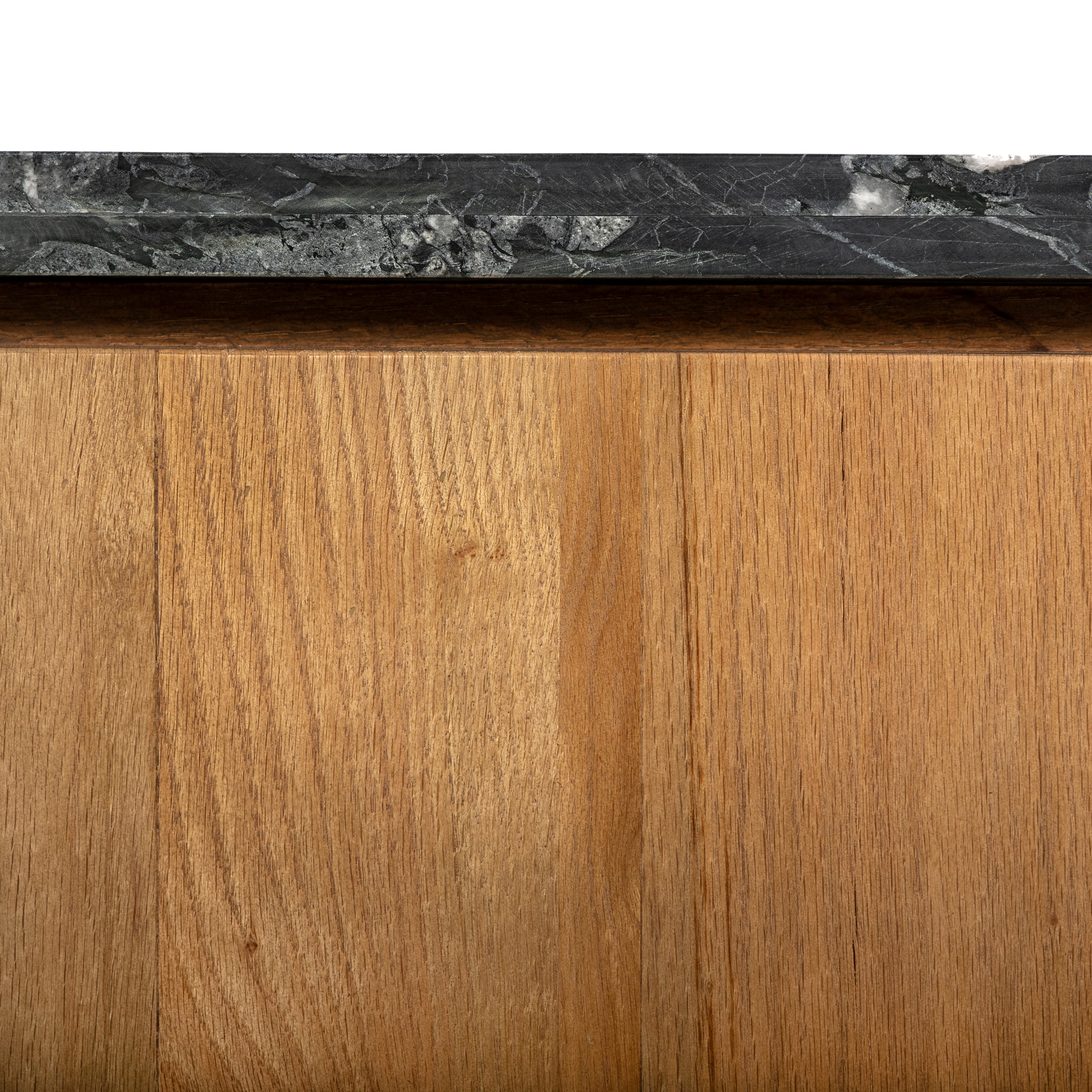 Mixed materials update this waterfall-style coffee table, as a warm oak base pairs with a sleek black marble tabletop. Amethyst Home provides interior design, new construction, custom furniture, and area rugs in the Salt Lake City metro area.