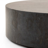 A cylinder-shaped coffee tables brings a shapely look to the living room. Made from natural polished bluestone for an organic look and feel.Collection: Hughe Amethyst Home provides interior design, new home construction design consulting, vintage area rugs, and lighting in the Washington metro area.