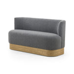 Featuring Krista Knoll Charcoal Dining Bench by Four Hands at Amethyst Home. Style takes shape. Comfortably curved bench seating is upholstered in a chunky charcoal boucle, with water-repellent high-performance fabric for modern sensibility. A plinth-style ash veneer base works casual contrast into the mix. Perfectly sized for a cozy breakfast nook; pair up t. Amethyst Home provides interior design, new home construction design consulting, vintage area rugs, and lighting in the Houston metro area.