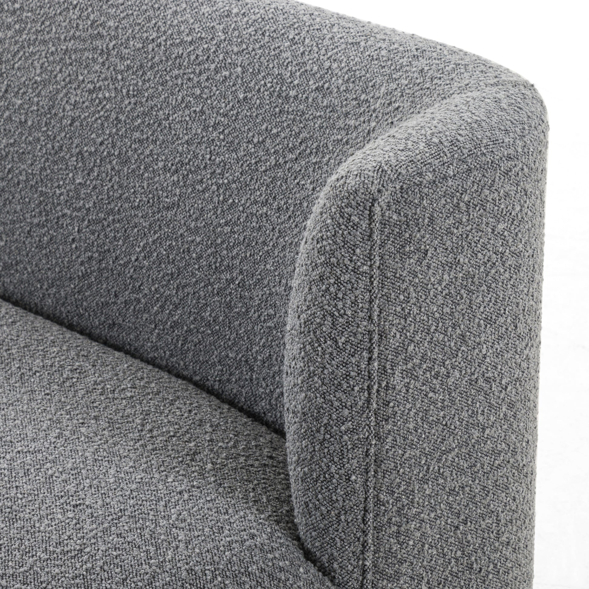 Style takes shape. Comfortably curved bench seating is upholstered in a chunky charcoal boucle, with water-repellent high-performance fabric for modern sensibility. A plinth-style ash veneer base works casual contrast into the mix. Perfectly sized for a cozy breakfast nook; pair up to suit a larger space. Amethyst Home provides interior design, new home construction design consulting, vintage area rugs, and lighting in the Los Angeles metro area.