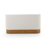 Featuring Krista Knoll Natural Dining Bench by Four Hands at Amethyst Home. Style takes shape. Comfortably curved bench seating is upholstered in a chunky off-white boucle, with water-repellent performance fabric for a modern touch. A plinth-style ash veneer base works casual contrast into the mix. Perfectly sized for a cozy breakfast nook; pair up to suit a l. Amethyst Home provides interior design, new home construction design consulting, vintage area rugs, and lighting in the Boston metro area.