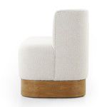 Featuring Krista Knoll Natural Dining Bench by Four Hands at Amethyst Home. Style takes shape. Comfortably curved bench seating is upholstered in a chunky off-white boucle, with water-repellent performance fabric for a modern touch. A plinth-style ash veneer base works casual contrast into the mix. Perfectly sized for a cozy breakfast nook; pair up to suit . Amethyst Home provides interior design, new home construction design consulting, vintage area rugs, and lighting in the Park City metro area.