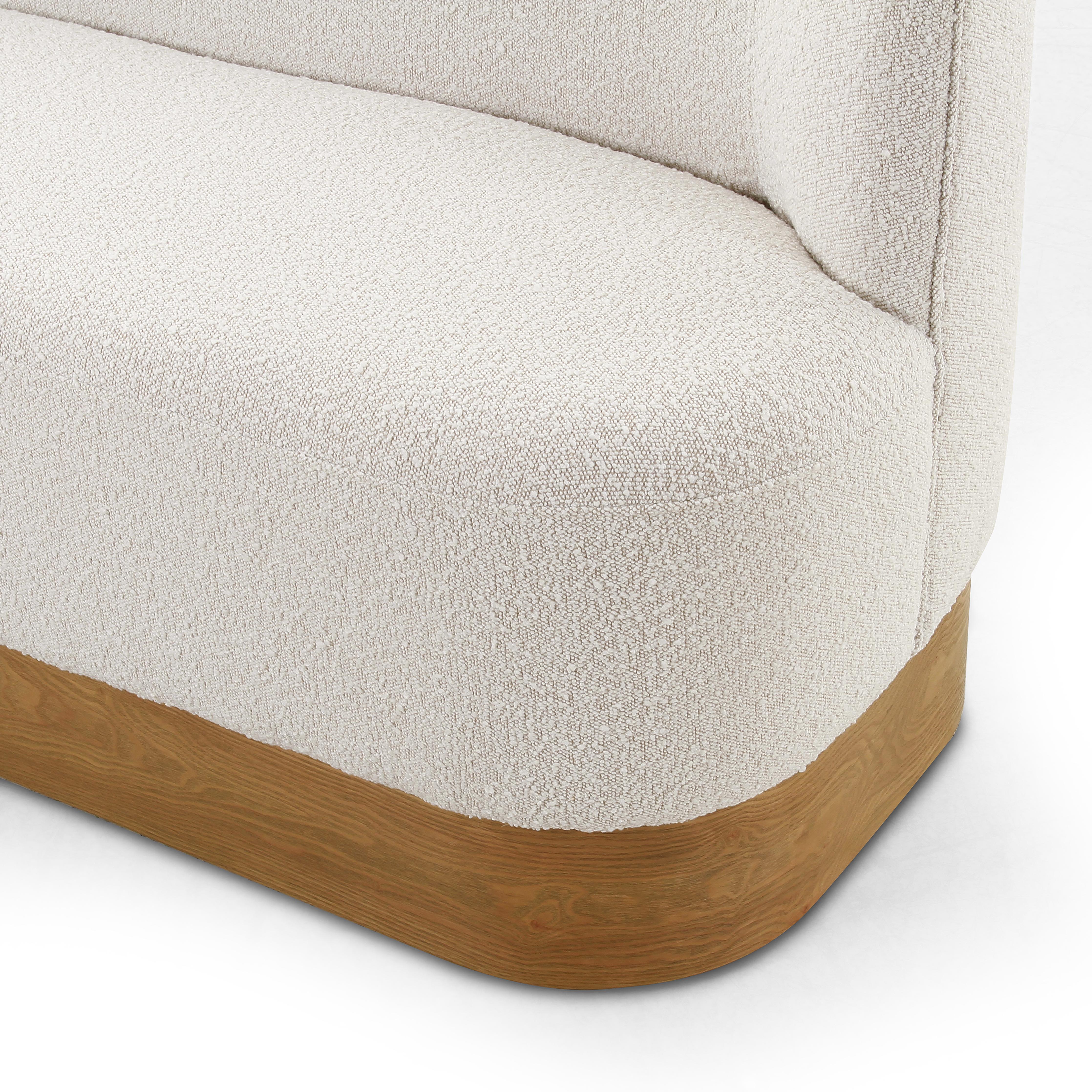 Featuring Krista Knoll Natural Dining Bench by Four Hands at Amethyst Home. Style takes shape. Comfortably curved bench seating is upholstered in a chunky off-white boucle, with water-repellent performance fabric for a modern touch. A plinth-style ash veneer base works casual contrast into the mix. Perfectly sized for a cozy breakfast nook; pair up to . Amethyst Home provides interior design, new home construction design consulting, vintage area rugs, and lighting in the Salt Lake City metro area.