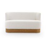Featuring Krista Knoll Natural Dining Bench by Four Hands at Amethyst Home. Style takes shape. Comfortably curved bench seating is upholstered in a chunky off-white boucle, with water-repellent performance fabric for a modern touch. A plinth-style ash veneer base works casual contrast into the mix. Perfectly sized for a cozy breakfast nook; pair up to suit . Amethyst Home provides interior design, new home construction design consulting, vintage area rugs, and lighting in the San Diego metro area.
