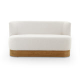 Featuring Krista Knoll Natural Dining Bench by Four Hands at Amethyst Home. Style takes shape. Comfortably curved bench seating is upholstered in a chunky off-white boucle, with water-repellent performance fabric for a modern touch. A plinth-style ash veneer base works casual contrast into the mix. Perfectly sized for a cozy breakfast nook; pair up to suit . Amethyst Home provides interior design, new home construction design consulting, vintage area rugs, and lighting in the San Diego metro area.