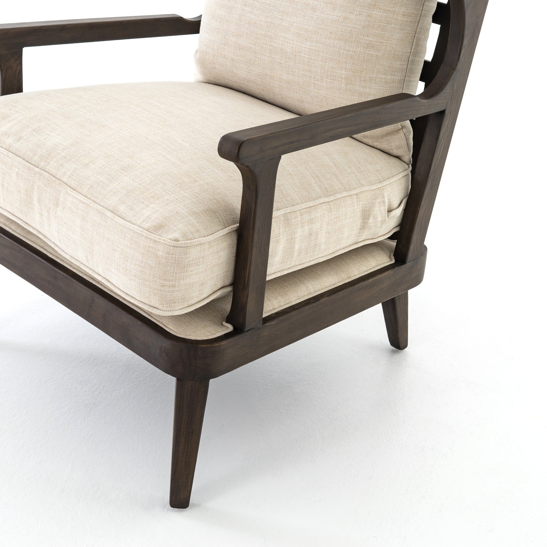 A solid frame of burnt oak features a high, ladder back design for a regal air. Ivory, performance fabric-upholstered seating meets style with livability. Performance fabrics are specially created to withstand spills, stains, high traffic and wear, ensuring long-term comfort and unmatched durability. Amethyst Home provides interior design, new construction, custom furniture, and area rugs in the Houston metro area.