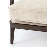 A solid frame of burnt oak features a high, ladder back design for a regal air. Ivory, performance fabric-upholstered seating meets style with livability. Performance fabrics are specially created to withstand spills, stains, high traffic and wear, ensuring long-term comfort and unmatched durability. Amethyst Home provides interior design, new construction, custom furniture, and area rugs in the Newport Beach metro area.