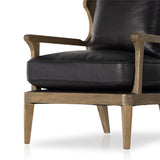 Featuring Lennon Heirloom Black Chair by Four Hands at Amethyst Home. A solid frame of warm oak features a high, ladder back design for a regal air. Upholstered in heirloom black leather. Sourced from one of the oldest family-owned tanneries in Italyâ€™s Bassano del Grappa, heirloom leather is salvaged and processed from upcycled hides featuring an abundance of natural markin. Amethyst Home provides interior design, new construction, custom furniture, and area rugs in the Newport Beach metro area.