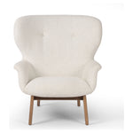 The classic wingback chair is updated with a midcentury-style base. Flared arms and a high winged back with blind tufting offer all-around comfort. Upholstered in a heavily textured boucle performance fabric bringing movement and everyday function to the piece. Amethyst Home provides interior design, new construction, custom furniture, and area rugs in the Salt Lake City metro area.