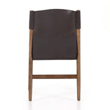 Sleek, streamlined seating with a midcentury vibe. Lulu Espresso Leather Armless Dining Chair features a sling leather seatback and a faux shearling seat in liquid-repellent performance fabric. Frame and legs made of solid ash wood. Amethyst Home provides interior design services, furniture, rugs, and lighting in the Kansas City metro area.