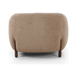 Lyla Sheepskin Camel Chair is a fresh take on the traditional tub chair, with exaggerated depth for drama and comfort. Solid wood legs intersect sheepskin upholstery for clean contrast and scale. Amethyst Home provides interior design services, furniture, rugs, and lighting in the Kansas City metro area.