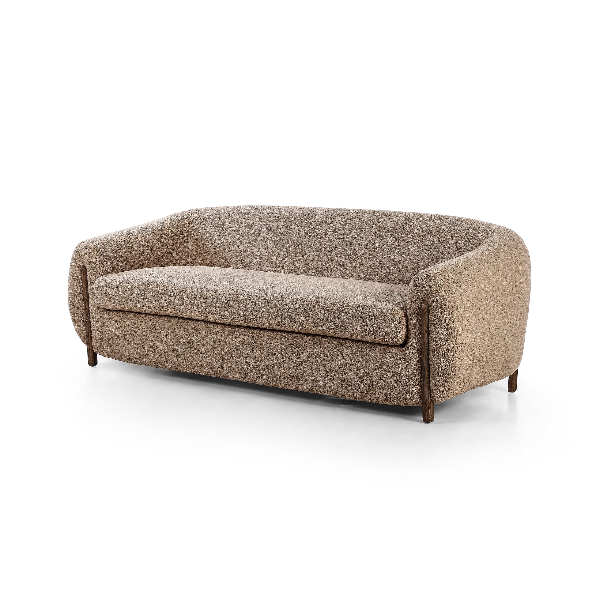 Lyla Sheepskin Camel Sofa is a fresh, elongated take on the traditional tub chair, with exaggerated depth for drama and comfort. Solid wood legs intersect sheepskin upholstery on this plush sofa for clean contrast and scale. Amethyst Home provides interior design services, furniture, rugs, and lighting in the Dallas metro area.