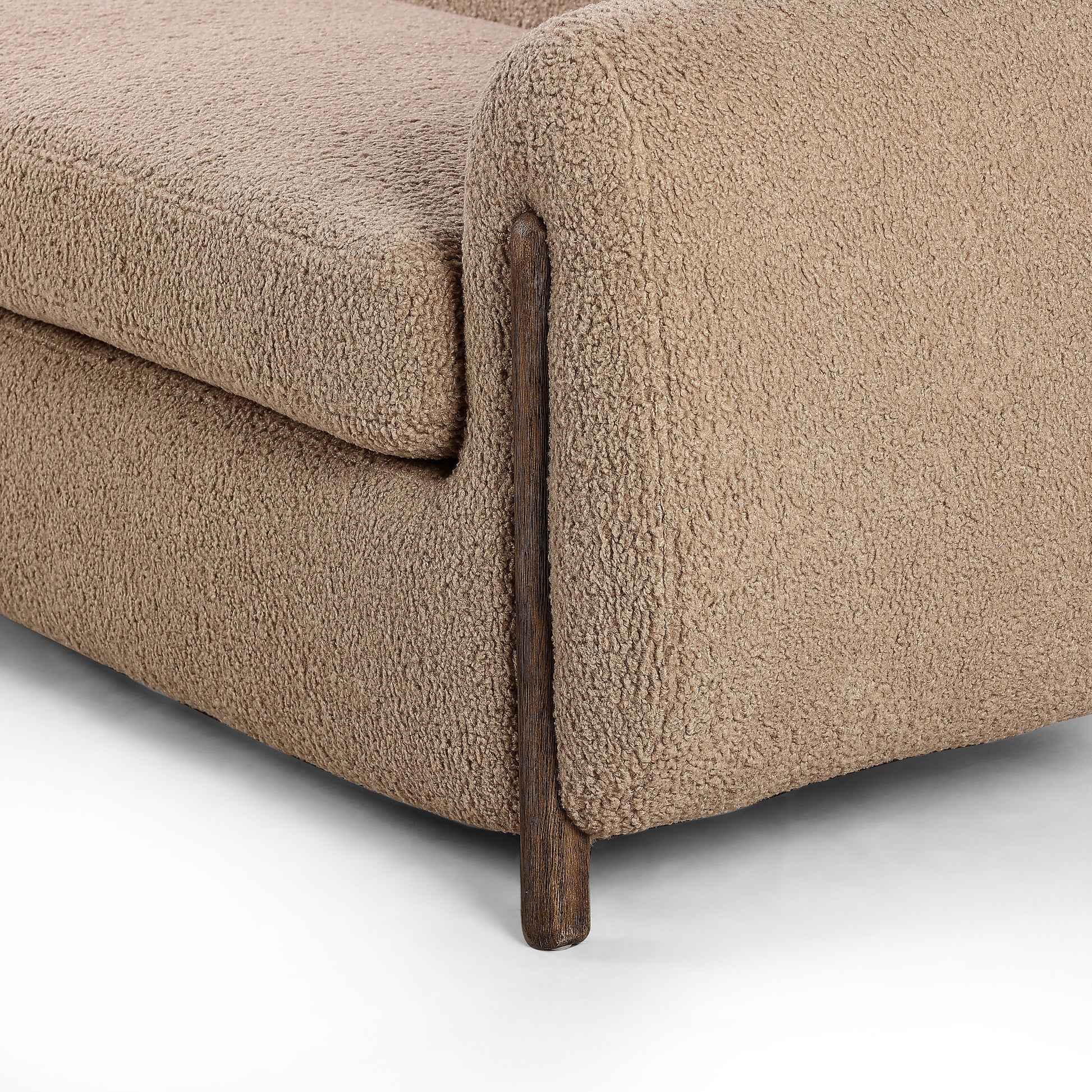 Lyla Sheepskin Camel Sofa is a fresh, elongated take on the traditional tub chair, with exaggerated depth for drama and comfort. Solid wood legs intersect sheepskin upholstery on this plush sofa for clean contrast and scale. Amethyst Home provides interior design services, furniture, rugs, and lighting in the Des Moines metro area.