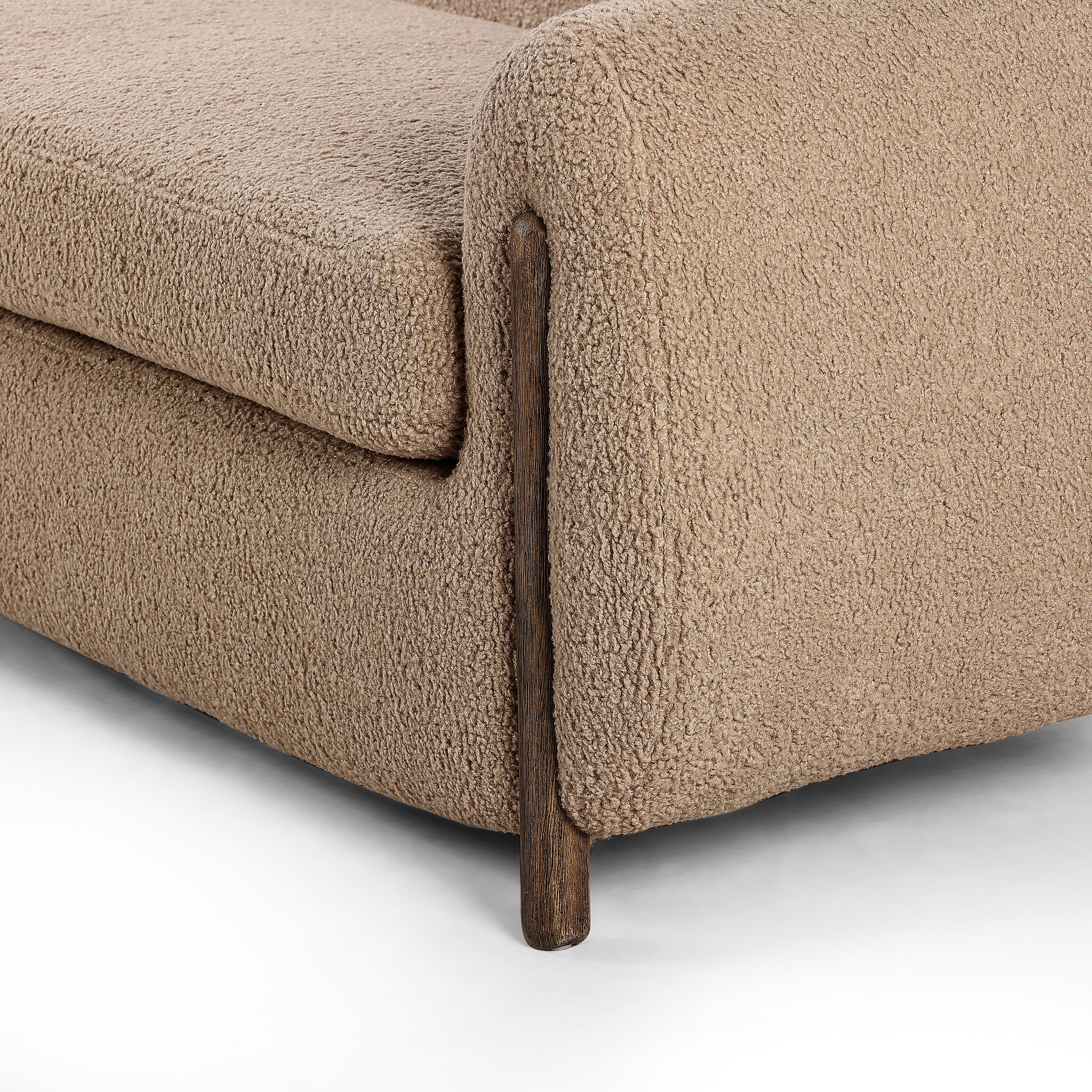 Lyla Sheepskin Camel Sofa is a fresh, elongated take on the traditional tub chair, with exaggerated depth for drama and comfort. Solid wood legs intersect sheepskin upholstery on this plush sofa for clean contrast and scale. Amethyst Home provides interior design services, furniture, rugs, and lighting in the Des Moines metro area.