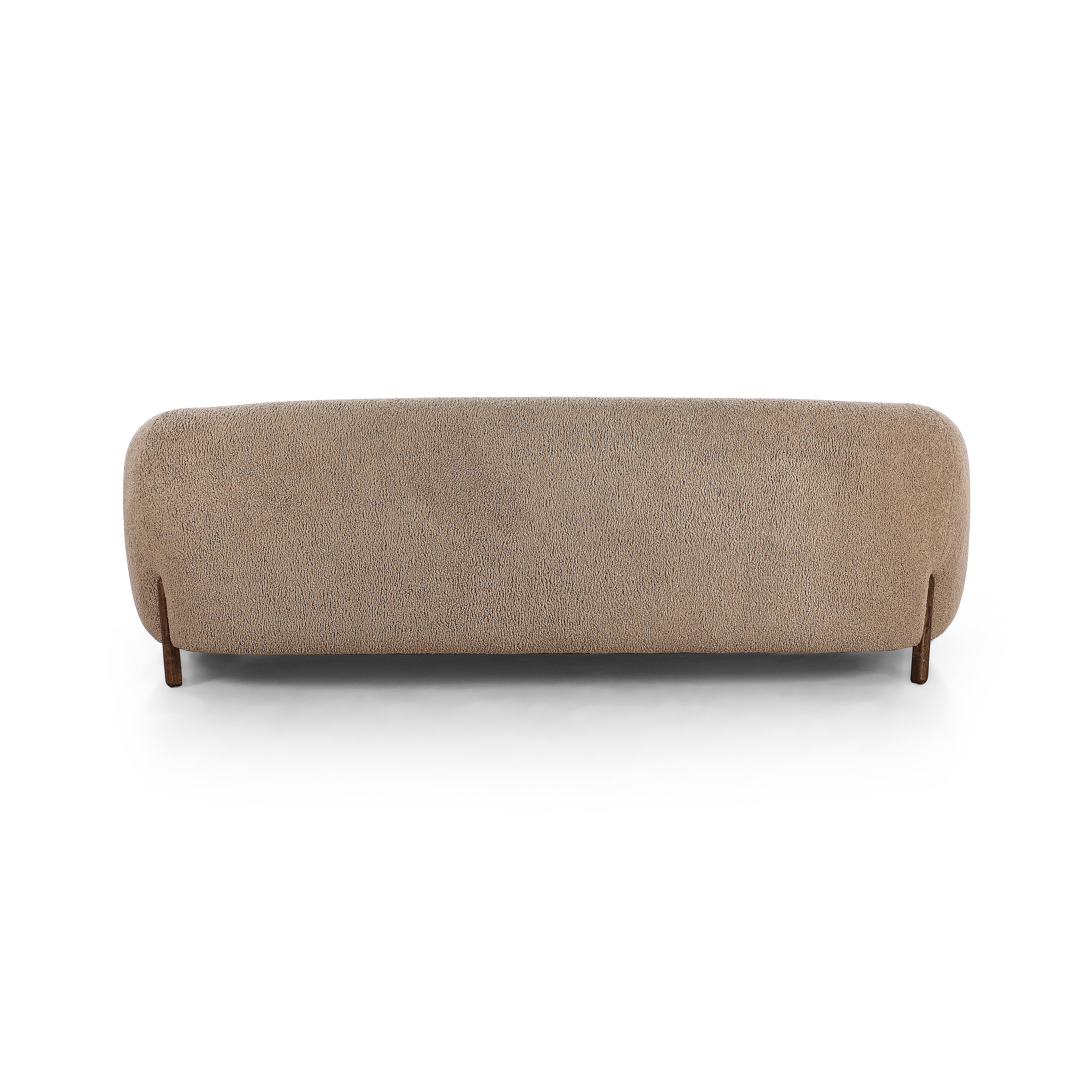 Lyla Sheepskin Camel Sofa is a fresh, elongated take on the traditional tub chair, with exaggerated depth for drama and comfort. Solid wood legs intersect sheepskin upholstery on this plush sofa for clean contrast and scale. Amethyst Home provides interior design services, furniture, rugs, and lighting in the Kansas City metro area.