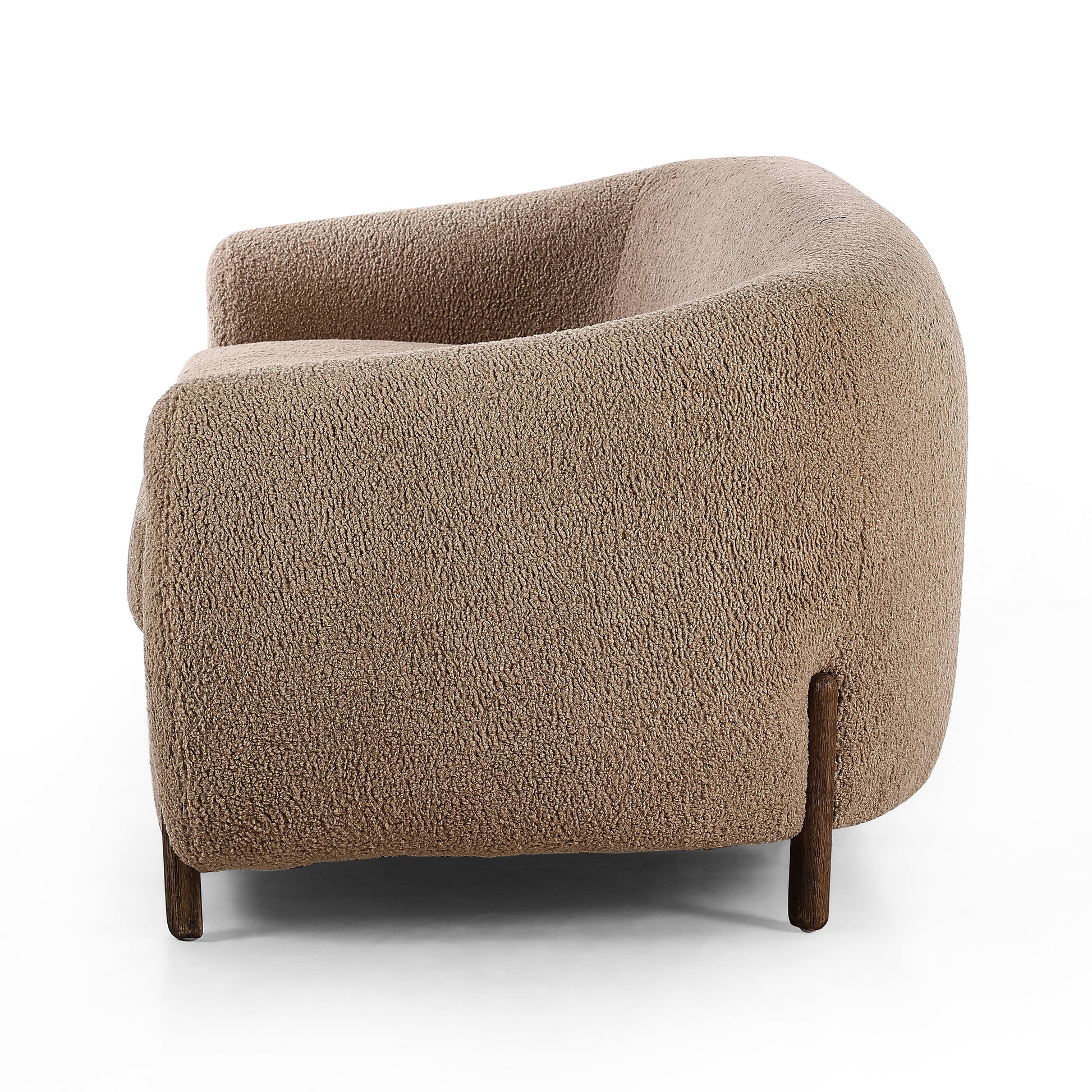Lyla Sheepskin Camel Sofa is a fresh, elongated take on the traditional tub chair, with exaggerated depth for drama and comfort. Solid wood legs intersect sheepskin upholstery on this plush sofa for clean contrast and scale. Amethyst Home provides interior design services, furniture, rugs, and lighting in the Monterey metro area.