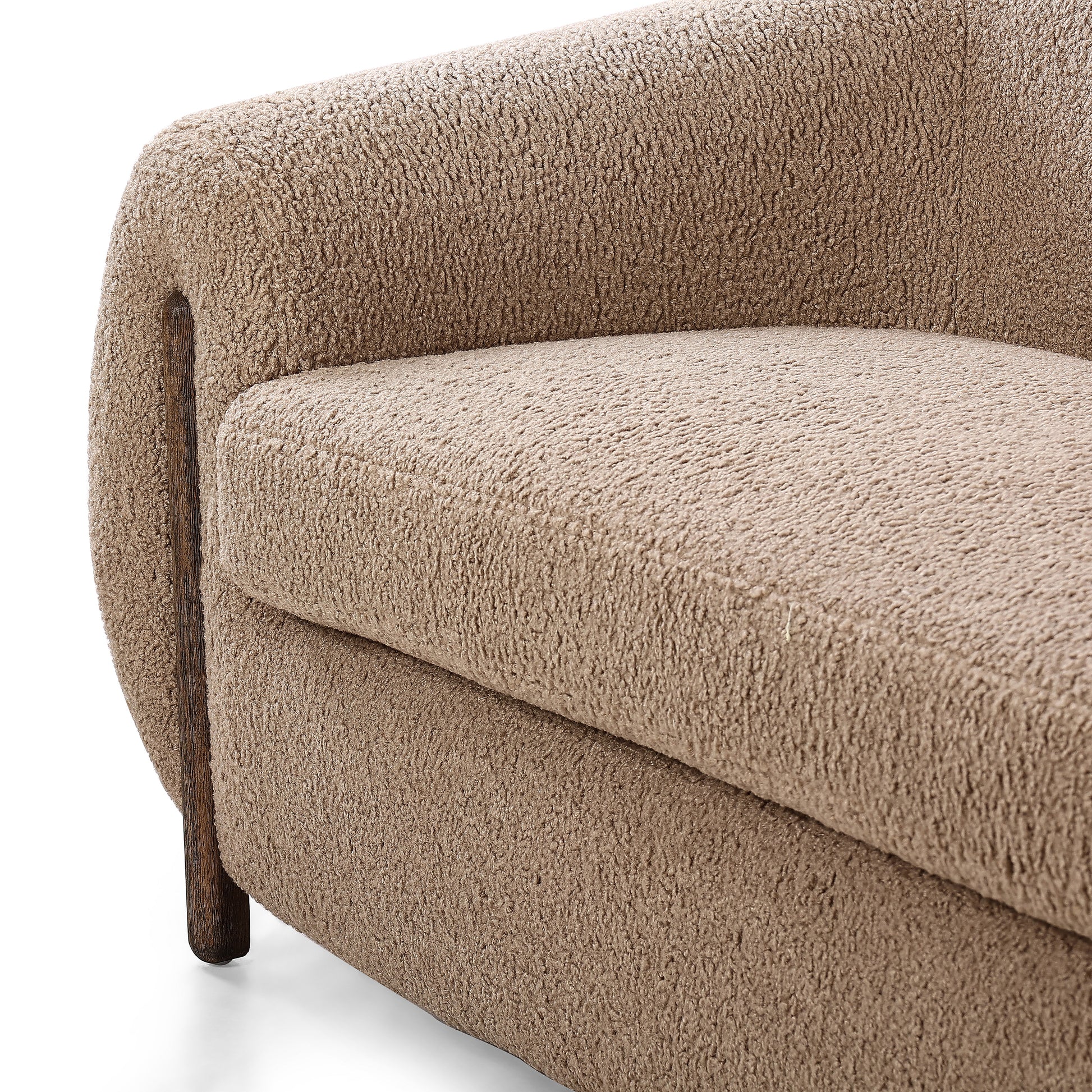 Lyla Sheepskin Camel Sofa is a fresh, elongated take on the traditional tub chair, with exaggerated depth for drama and comfort. Solid wood legs intersect sheepskin upholstery on this plush sofa for clean contrast and scale. Amethyst Home provides interior design services, furniture, rugs, and lighting in the Seattle metro area.