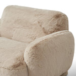 Oversized and modern, this arm chair is a statement piece whether styled alone or with an existing living room setup. The neutral faux fur covering subdues bold arms and cylindrical legs. With spring suspension in the seat cushion and webbed suspension in the back, the piece is designed with durability and comfort in mind.Collection: Carnegi Amethyst Home provides interior design, new home construction design consulting, vintage area rugs, and lighting in the Omaha metro area.