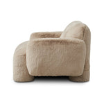 Oversized and modern, this arm chair is a statement piece whether styled alone or with an existing living room setup. The neutral faux fur covering subdues bold arms and cylindrical legs. With spring suspension in the seat cushion and webbed suspension in the back, the piece is designed with durability and comfort in mind.Collection: Carnegi Amethyst Home provides interior design, new home construction design consulting, vintage area rugs, and lighting in the Salt Lake City metro area.