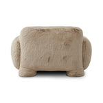 Oversized and modern, this arm chair is a statement piece whether styled alone or with an existing living room setup. The neutral faux fur covering subdues bold arms and cylindrical legs. With spring suspension in the seat cushion and webbed suspension in the back, the piece is designed with durability and comfort in mind.Collection: Carnegi Amethyst Home provides interior design, new home construction design consulting, vintage area rugs, and lighting in the San Diego metro area.