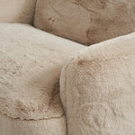Oversized and modern, this arm chair is a statement piece whether styled alone or with an existing living room setup. The neutral faux fur covering subdues bold arms and cylindrical legs. With spring suspension in the seat cushion and webbed suspension in the back, the piece is designed with durability and comfort in mind.Collection: Carnegi Amethyst Home provides interior design, new home construction design consulting, vintage area rugs, and lighting in the Scottsdale metro area.