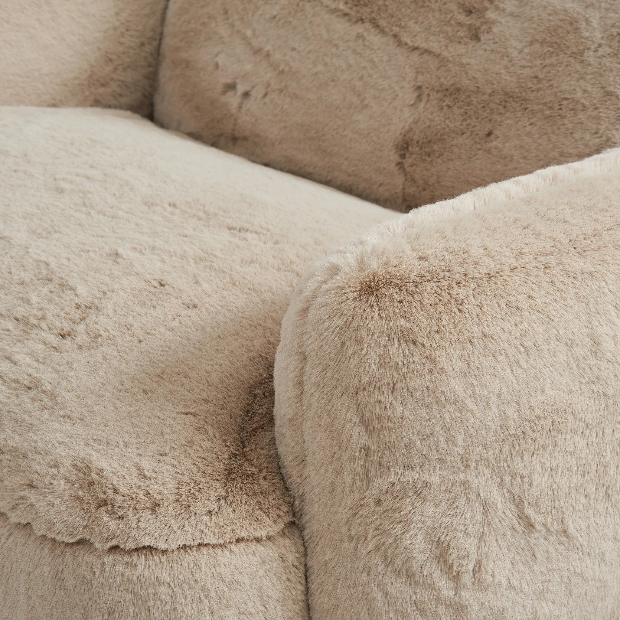 Oversized and modern, this arm chair is a statement piece whether styled alone or with an existing living room setup. The neutral faux fur covering subdues bold arms and cylindrical legs. With spring suspension in the seat cushion and webbed suspension in the back, the piece is designed with durability and comfort in mind.Collection: Carnegi Amethyst Home provides interior design, new home construction design consulting, vintage area rugs, and lighting in the Scottsdale metro area.