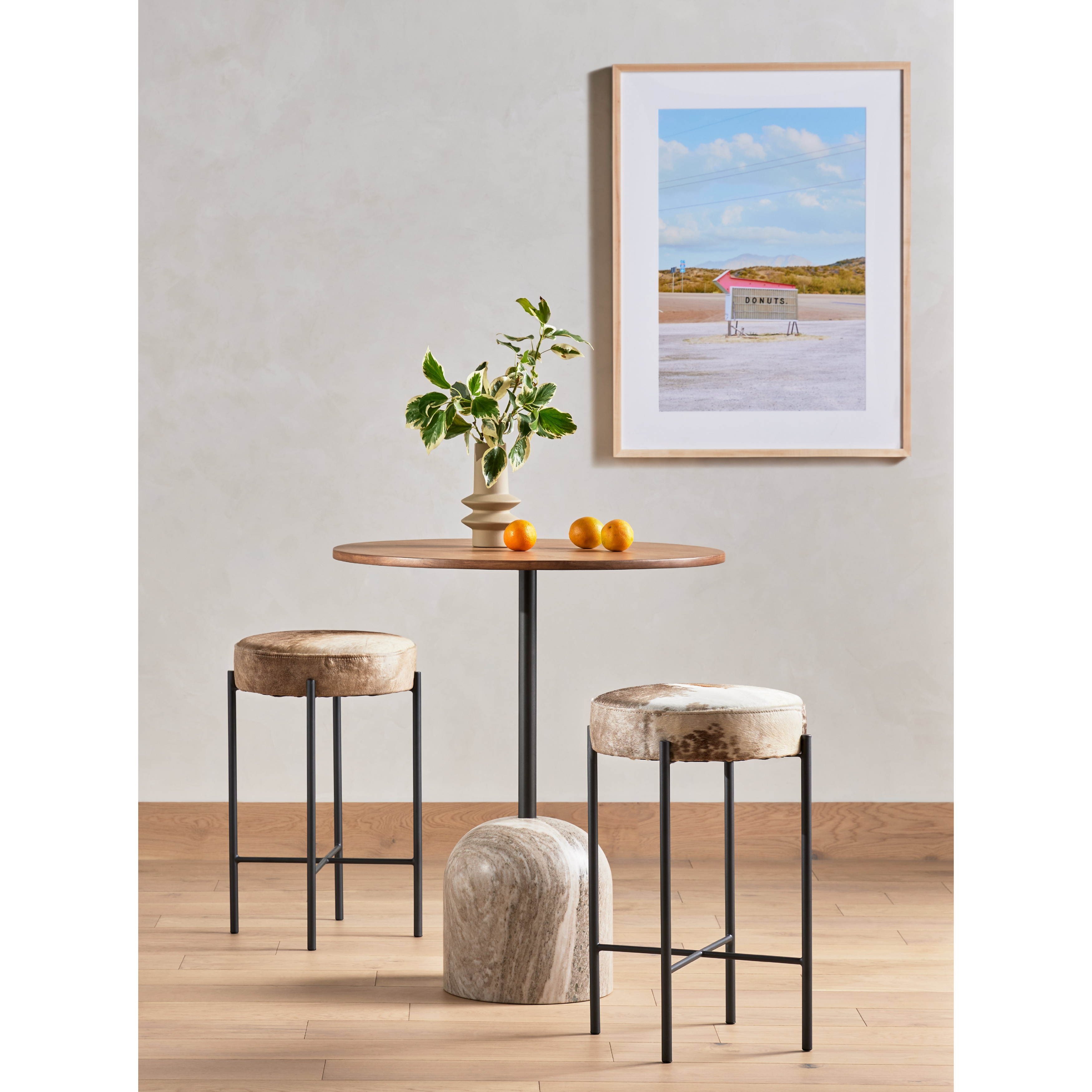 The Nocona Speckled Hide Bar and Counter stool is modern minimalist to a T. Slim and airy, gunmetal-finished iron legs form a cradle-style frame for speckled hide seating, perfectly sized for the counter or bar. Amethyst Home provides interior design, new construction, custom furniture, and rugs for the Des Moines and Cedar Rapids, Iowa metro area.