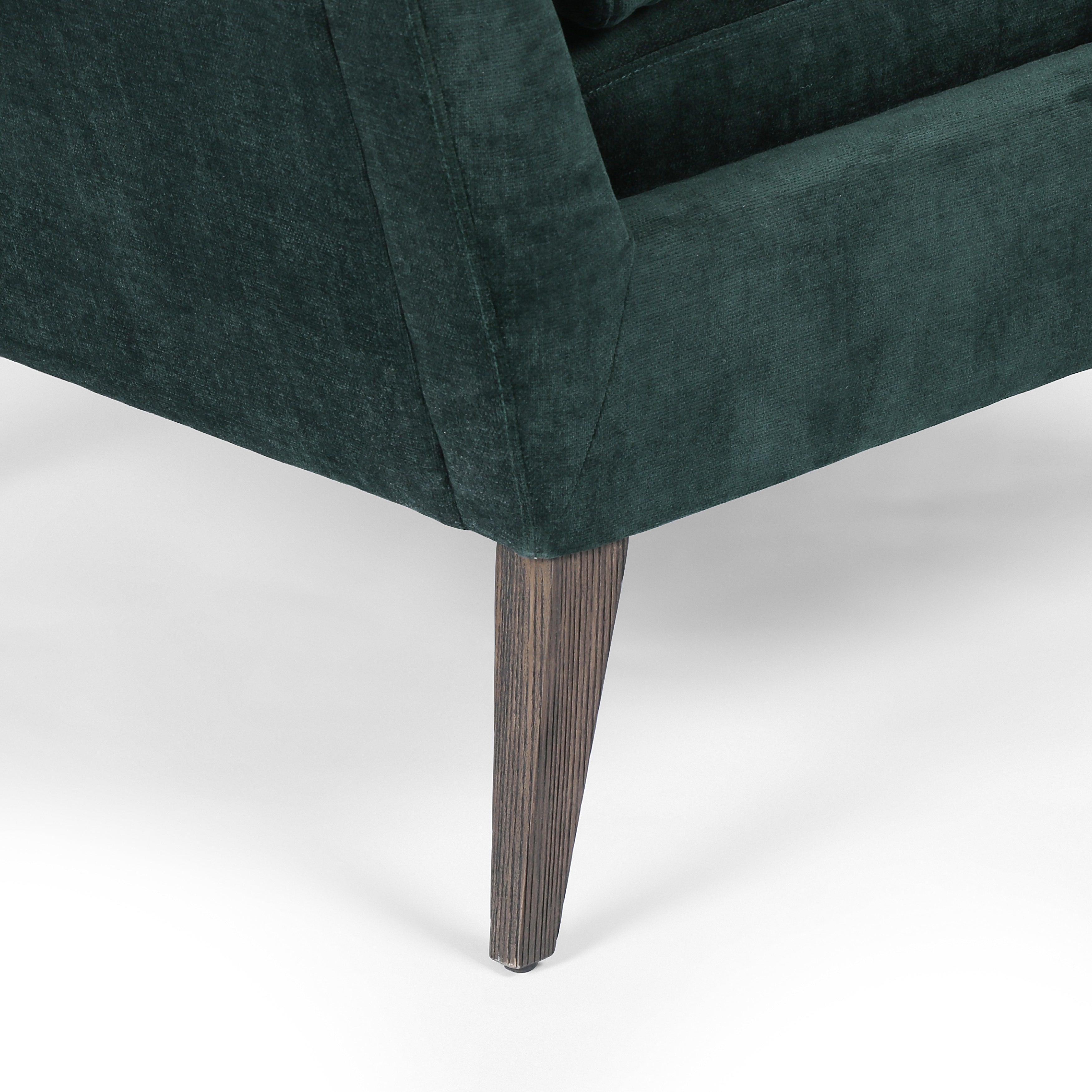 Featuring Olson Emerald Worn Velvet Chair by Four Hands at Amethyst Home. A clean, sophisticated silhouette meets velvety emerald upholstery with side-arm cutouts, for a balanced look with a mid-century air. Tapered oak legs add a feminine finishing touch. Performance fabrics are specially created to withstand spills, stains, high traffic and wear, ensuring long-term comfort and unm. Amethyst Home provides interior design, new construction, custom furniture, and area rugs in the Dallas metro area.