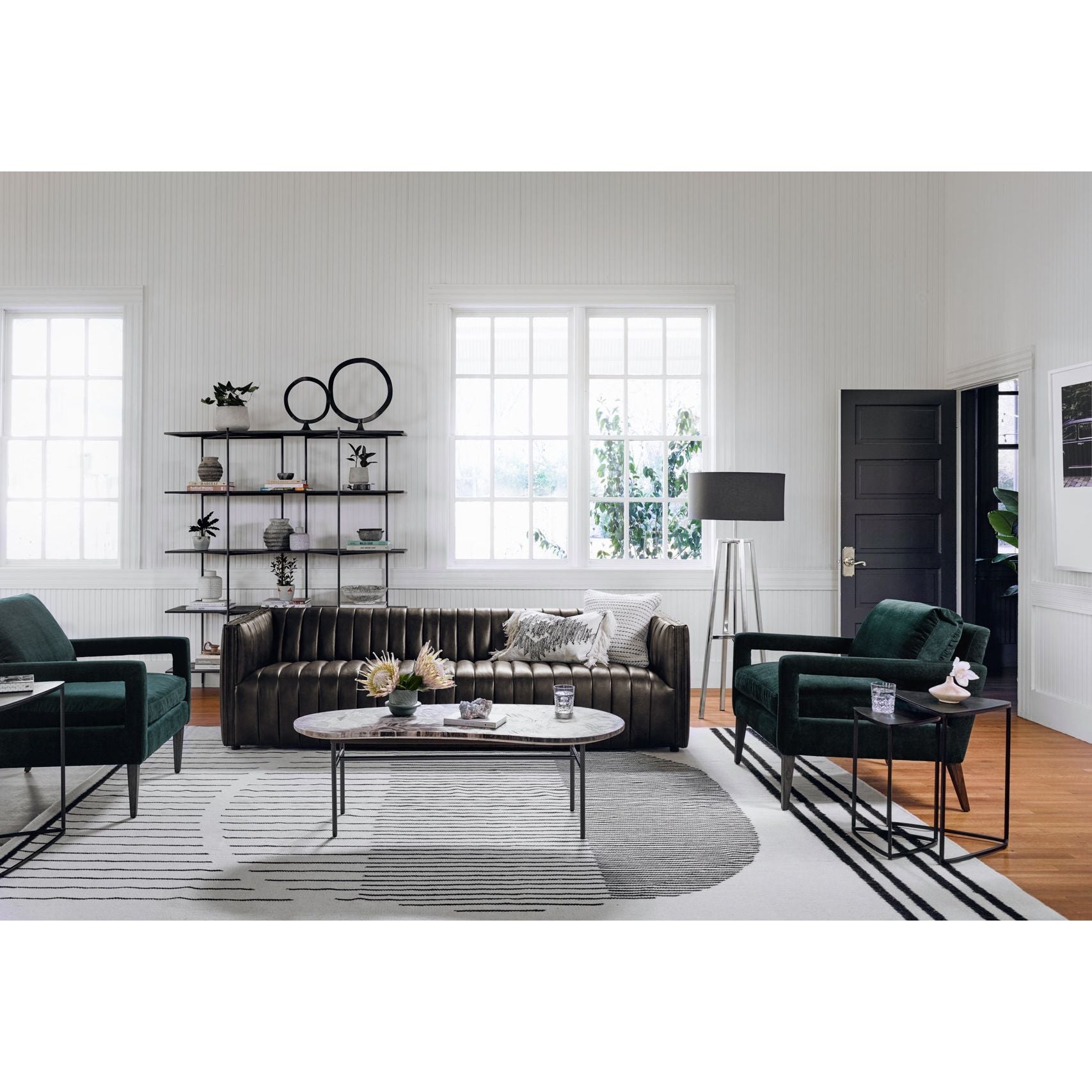 Featuring Olson Emerald Worn Velvet Chair by Four Hands at Amethyst Home. A clean, sophisticated silhouette meets velvety emerald upholstery with side-arm cutouts, for a balanced look with a mid-century air. Tapered oak legs add a feminine finishing touch. Performance fabrics are specially created to withstand spills, stains, high traffic and wear, ensuring long-term comfort and. Amethyst Home provides interior design, new construction, custom furniture, and area rugs in the Washington metro area.