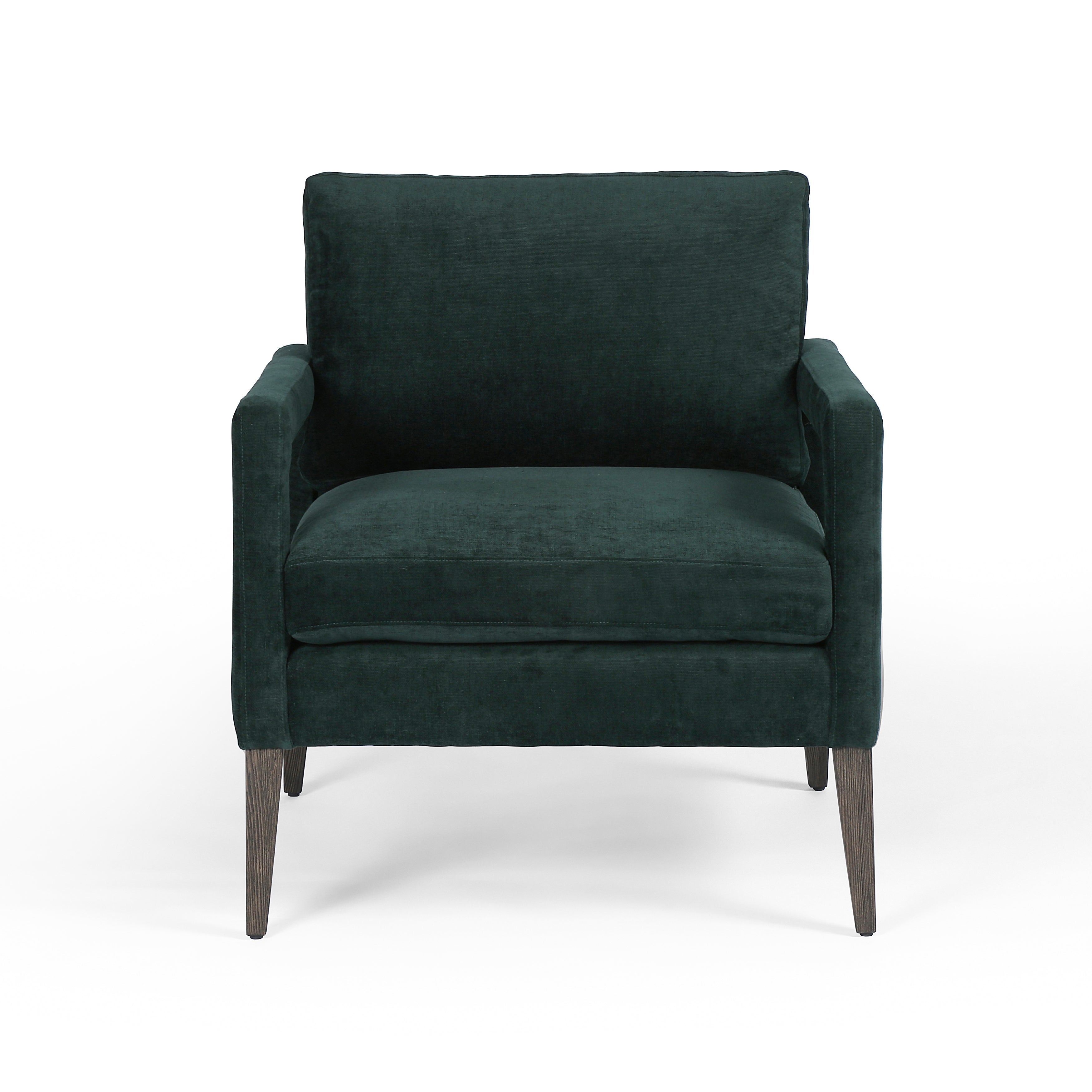 Featuring Olson Emerald Worn Velvet Chair by Four Hands at Amethyst Home. A clean, sophisticated silhouette meets velvety emerald upholstery with side-arm cutouts, for a balanced look with a mid-century air. Tapered oak legs add a feminine finishing touch. Performance fabrics are specially created to withstand spills, stains, high traffic and wear, ensuring long-term comfort . Amethyst Home provides interior design, new construction, custom furniture, and area rugs in the Winter Garden metro area.