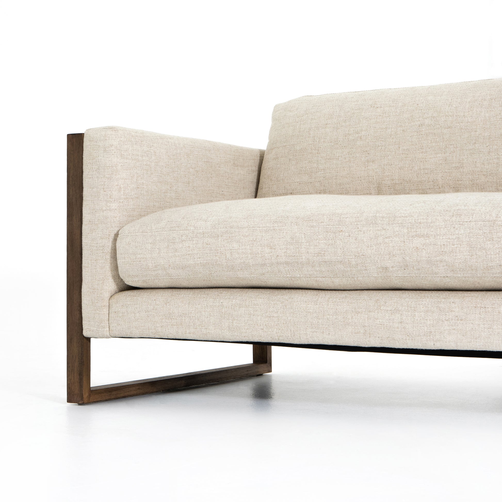 Crisp, clean comfort. Cream-colored upholstery of performance grade cradles within an exposed parawood frame, for detail-driven contrast. Performance fabrics are specially created to withstand spills, stains, high traffic and wear, ensuring long-term comfort and unmatched durability. Amethyst Home provides interior design, new construction, custom furniture, and area rugs in the Austin metro area.