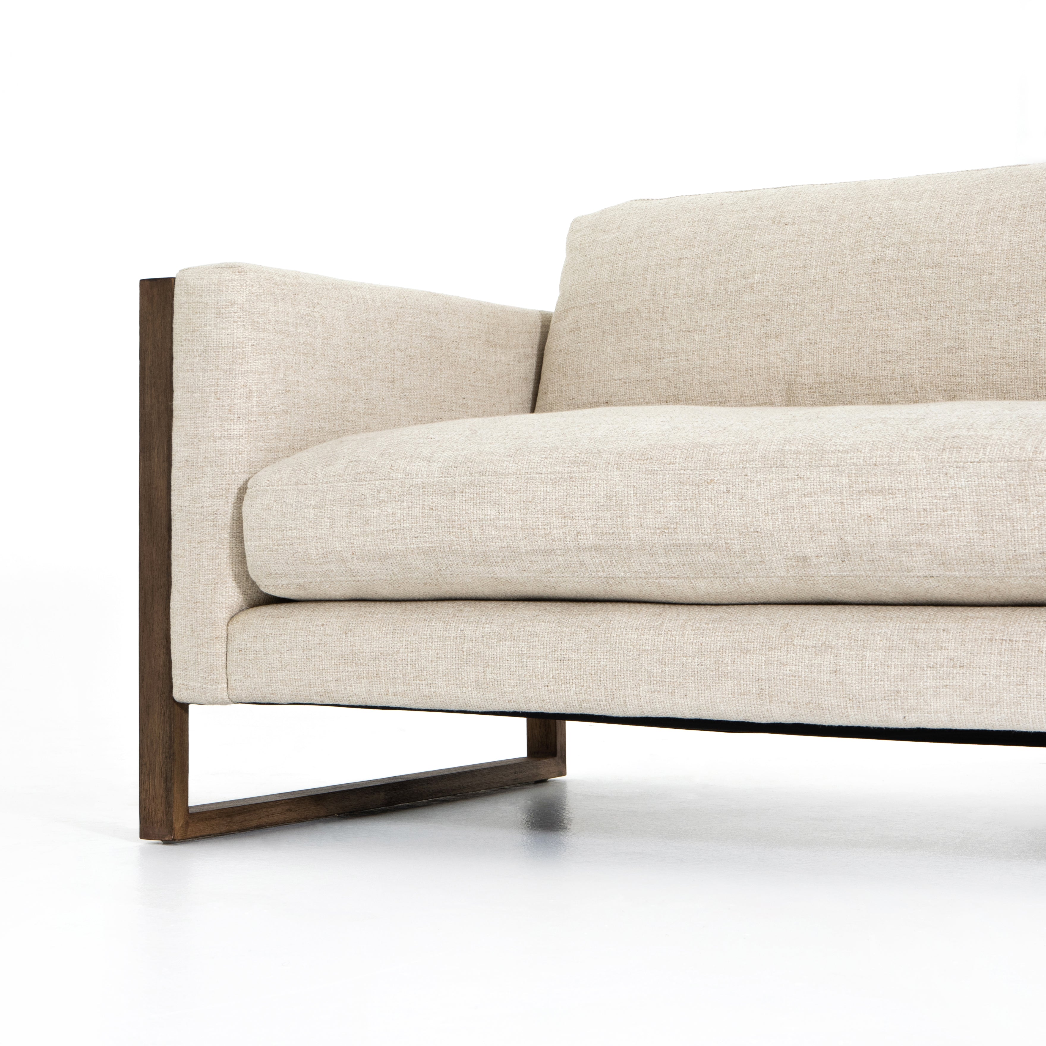 Crisp, clean comfort. Cream-colored upholstery of performance grade cradles within an exposed parawood frame, for detail-driven contrast. Performance fabrics are specially created to withstand spills, stains, high traffic and wear, ensuring long-term comfort and unmatched durability. Amethyst Home provides interior design, new construction, custom furniture, and area rugs in the Austin metro area.