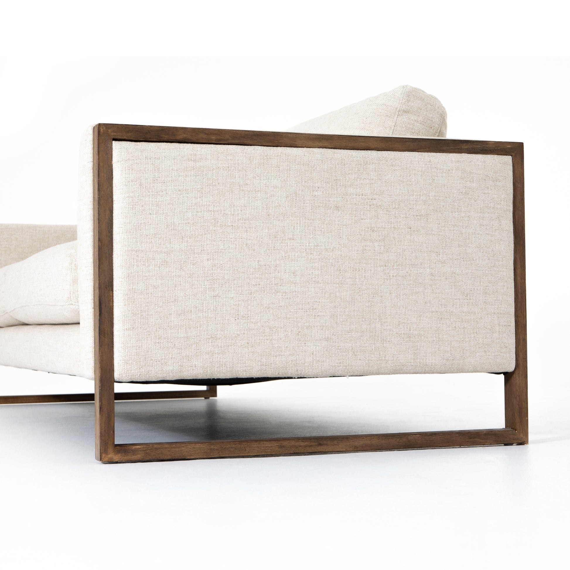 Crisp, clean comfort. Cream-colored upholstery of performance grade cradles within an exposed parawood frame, for detail-driven contrast. Performance fabrics are specially created to withstand spills, stains, high traffic and wear, ensuring long-term comfort and unmatched durability. Amethyst Home provides interior design, new construction, custom furniture, and area rugs in the Boston metro area.