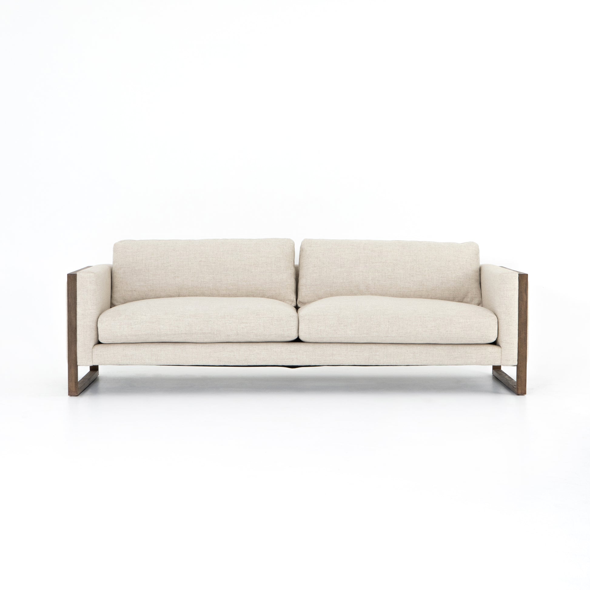 Crisp, clean comfort. Cream-colored upholstery of performance grade cradles within an exposed parawood frame, for detail-driven contrast. Performance fabrics are specially created to withstand spills, stains, high traffic and wear, ensuring long-term comfort and unmatched durability. Amethyst Home provides interior design, new construction, custom furniture, and area rugs in the Tampa metro area.