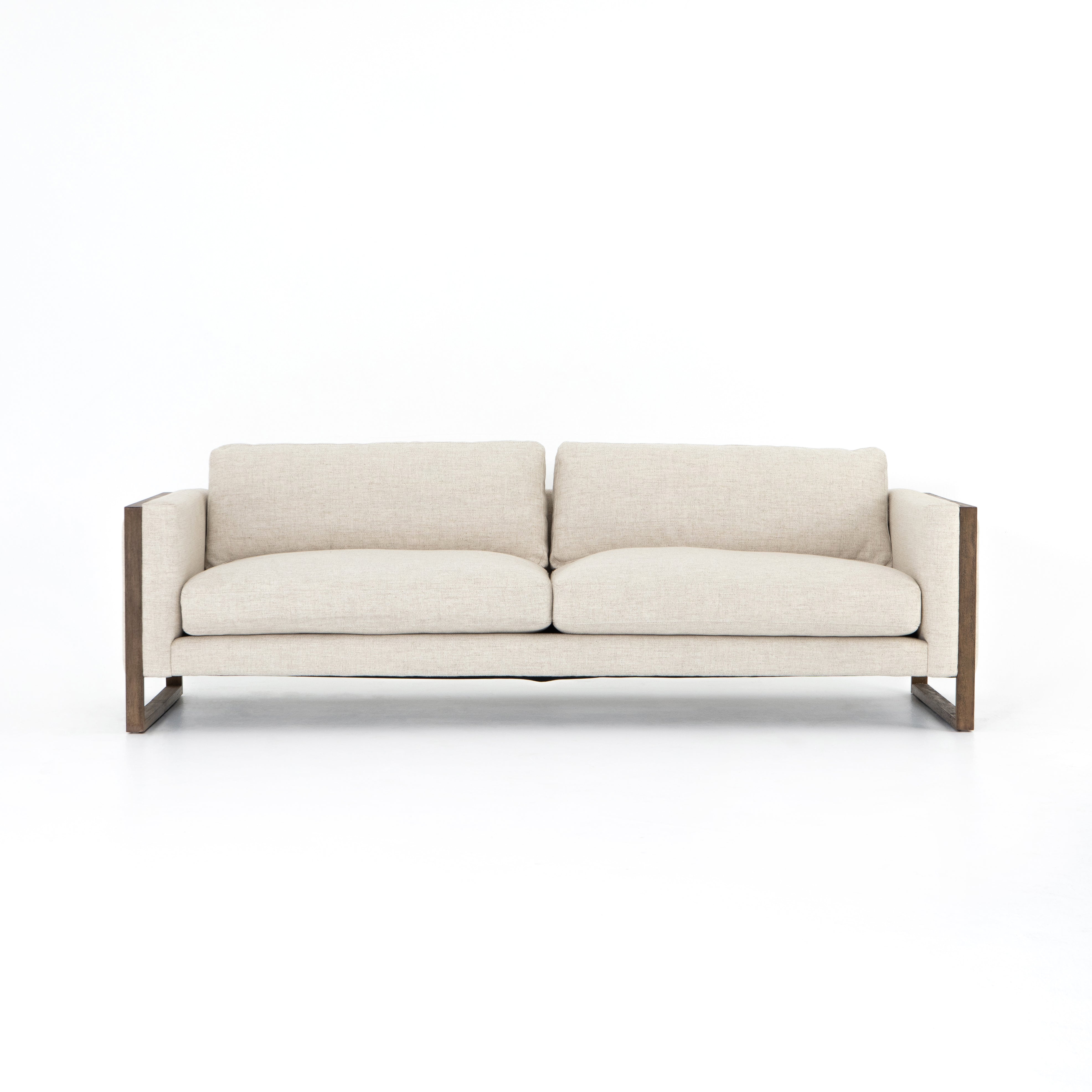 Crisp, clean comfort. Cream-colored upholstery of performance grade cradles within an exposed parawood frame, for detail-driven contrast. Performance fabrics are specially created to withstand spills, stains, high traffic and wear, ensuring long-term comfort and unmatched durability. Amethyst Home provides interior design, new construction, custom furniture, and area rugs in the Tampa metro area.