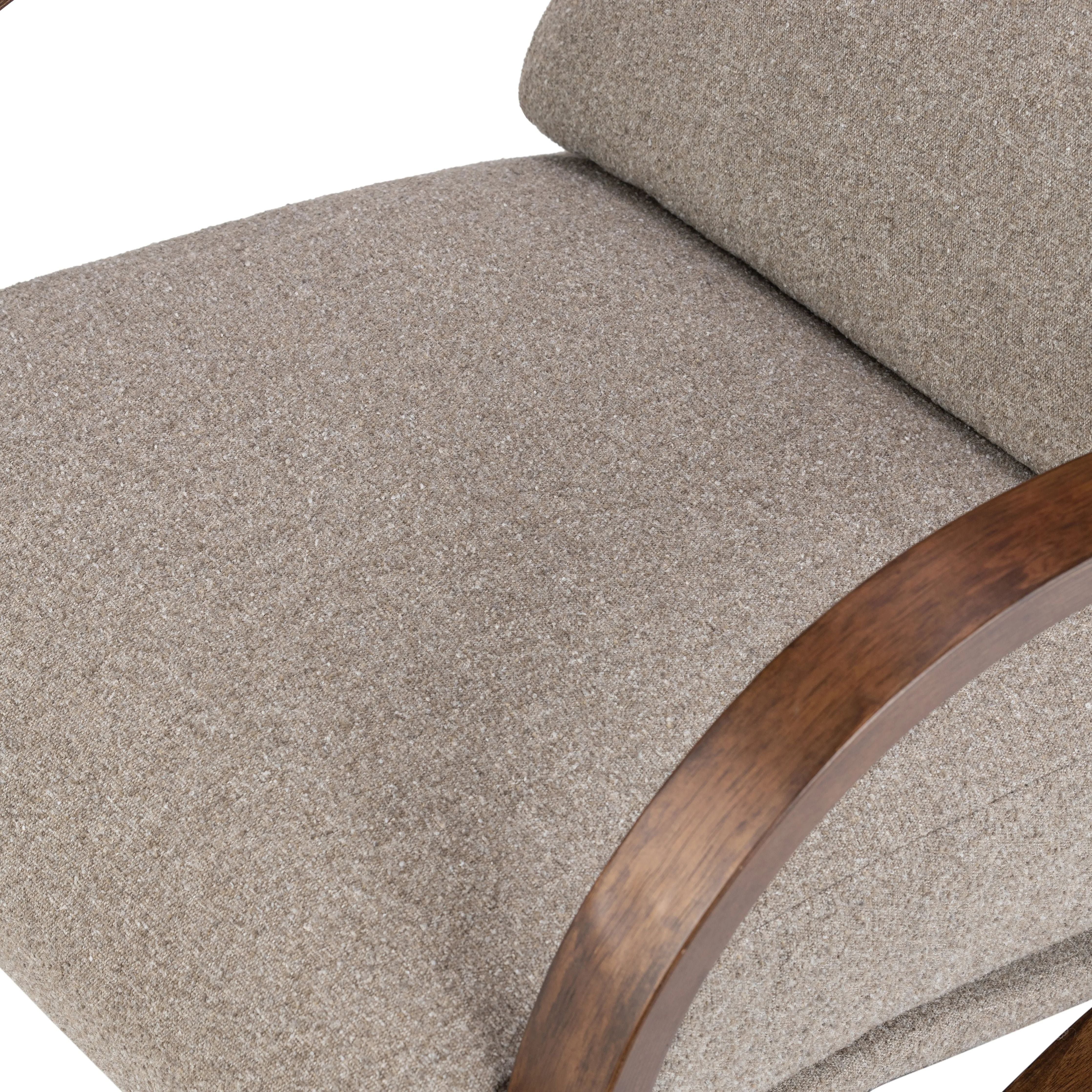 Inspired by vintage rocking chairs, the whimsical frame of this accent chair hugs removable plush feather foam-blend cushions on a webbed suspension style construction for true sink-in comfort. Cushions are upholstered in a new Turkish-made fabric made from 100% recycled olefin yarns with a tweed-like texture and feel Amethyst Home provides interior design, new home construction design consulting, vintage area rugs, and lighting in the Kansas City metro area.