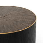 Bring on the drama. An ebony-finished oak top is cut in a starburst texture, framed by deep ebony sides, and encircled by bright brass-clad binding. Amethyst Home provides interior design, new construction, custom furniture, and area rugs in the Tampa metro area.