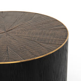 Bring on the drama. An ebony-finished oak top is cut in a starburst texture, framed by deep ebony sides, and encircled by bright brass-clad binding. Amethyst Home provides interior design, new construction, custom furniture, and area rugs in the Tampa metro area.