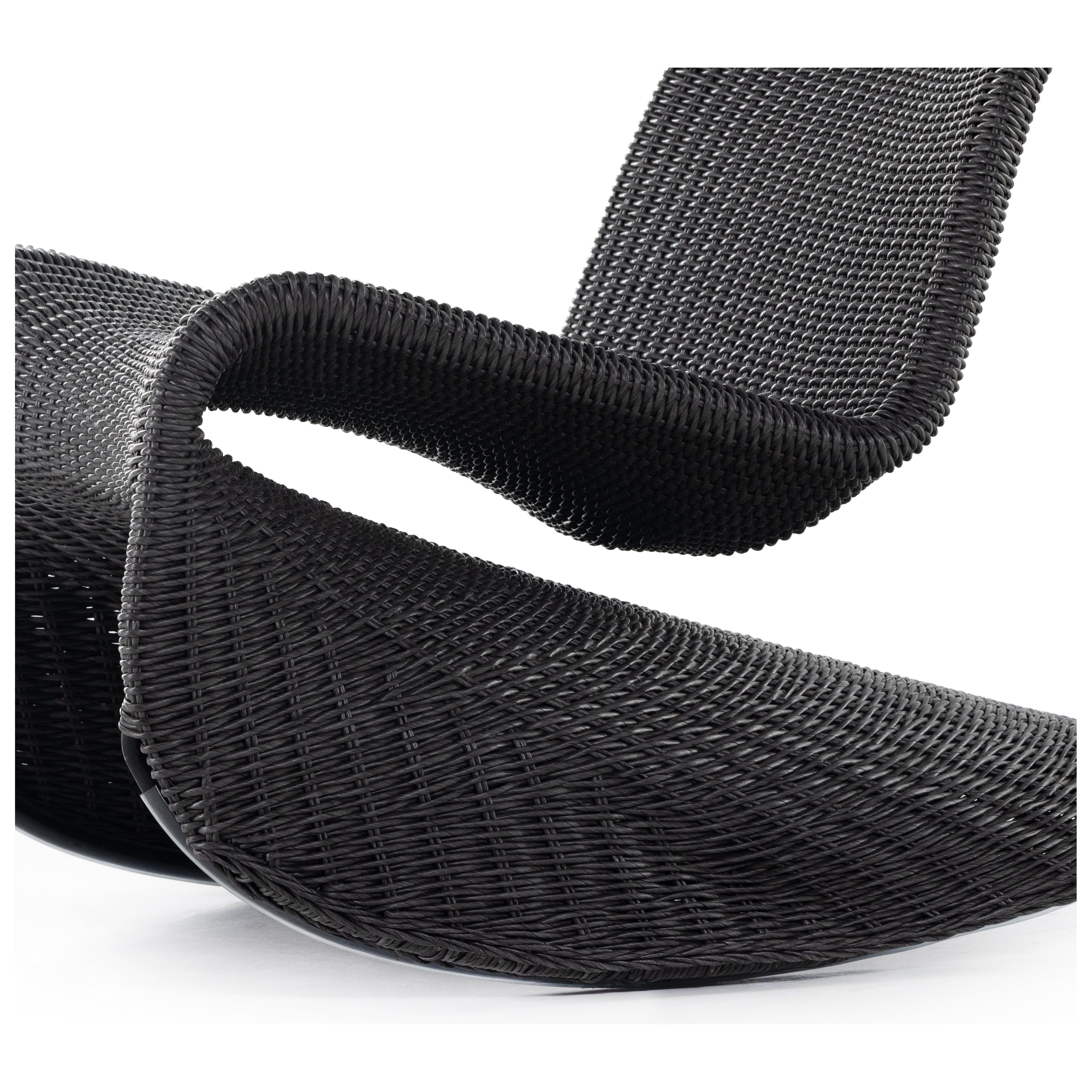 Based off a vintage shape, all-weather wicker seating brings dramatic curves to this statement-making rocking chair. Cover or store indoors during inclement weather and when not in use. Amethyst Home provides interior design, new construction, custom furniture, and area rugs in the Laguna Beach metro area.