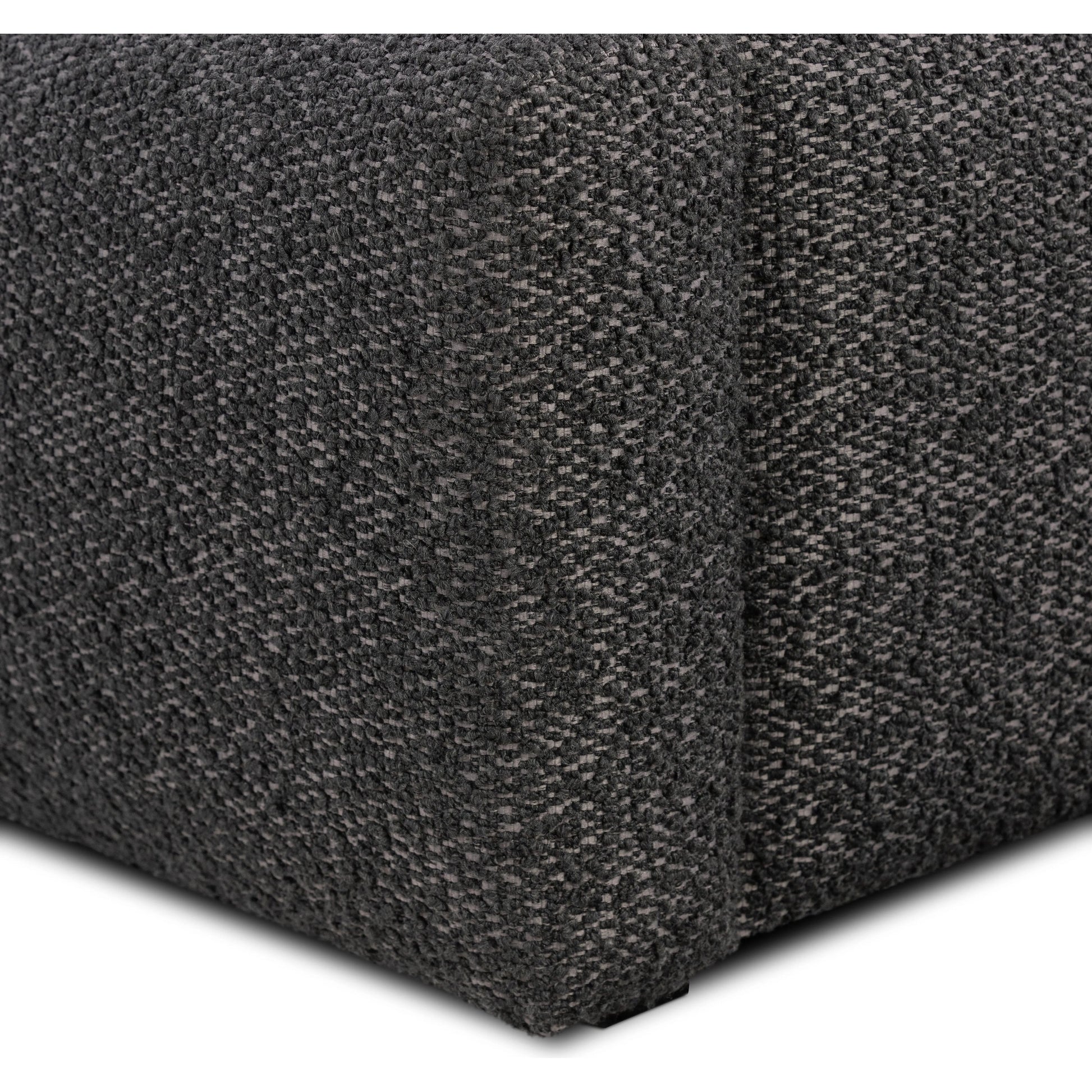 Modern, clean shaping meets inflated comfort with this padded, upholstered bed frame in a textural boucle-like pattern Amethyst Home provides interior design, new home construction design consulting, vintage area rugs, and lighting in the Charlotte metro area.