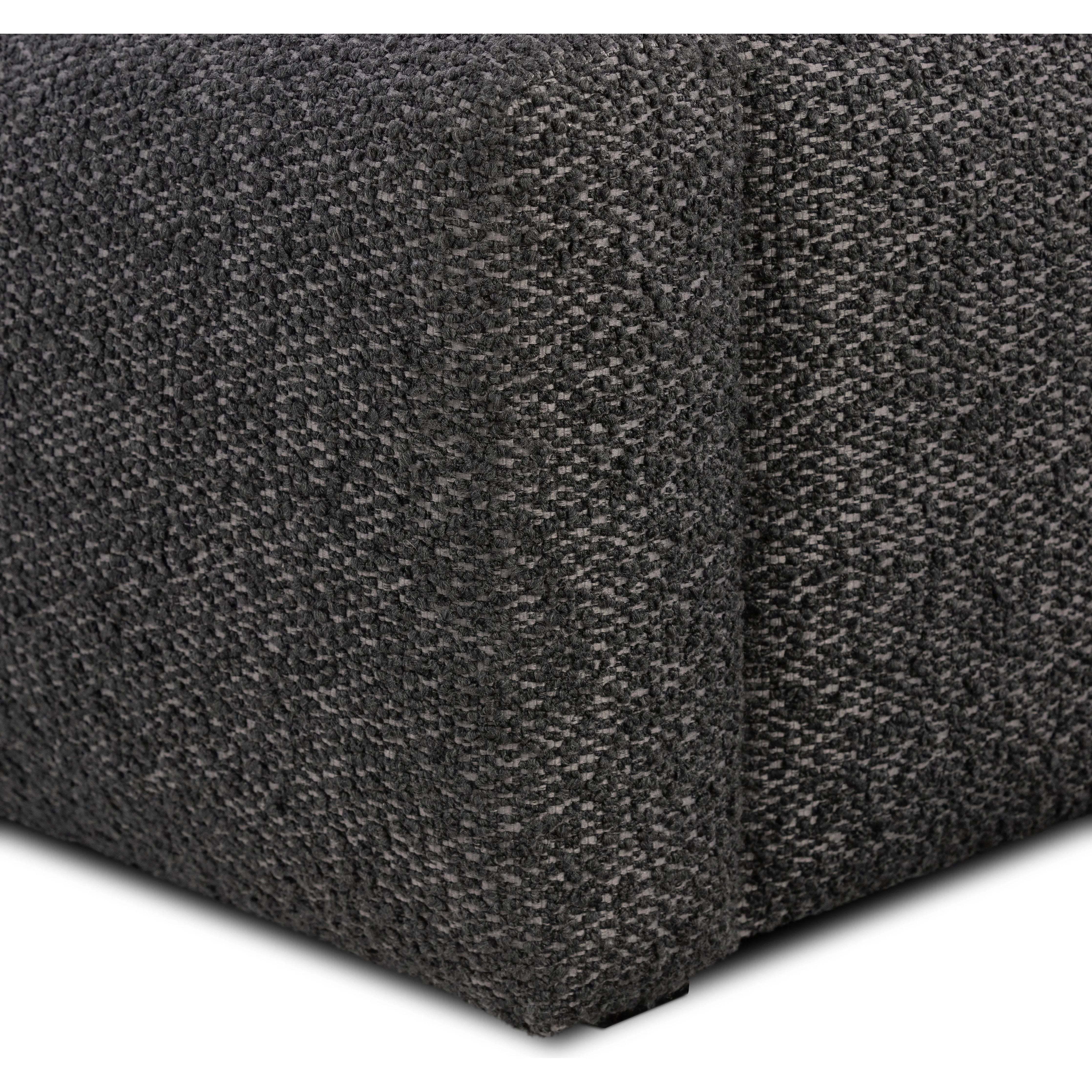 Modern, clean shaping meets inflated comfort with this padded, upholstered bed frame in a textural boucle-like pattern Amethyst Home provides interior design, new home construction design consulting, vintage area rugs, and lighting in the Charlotte metro area.
