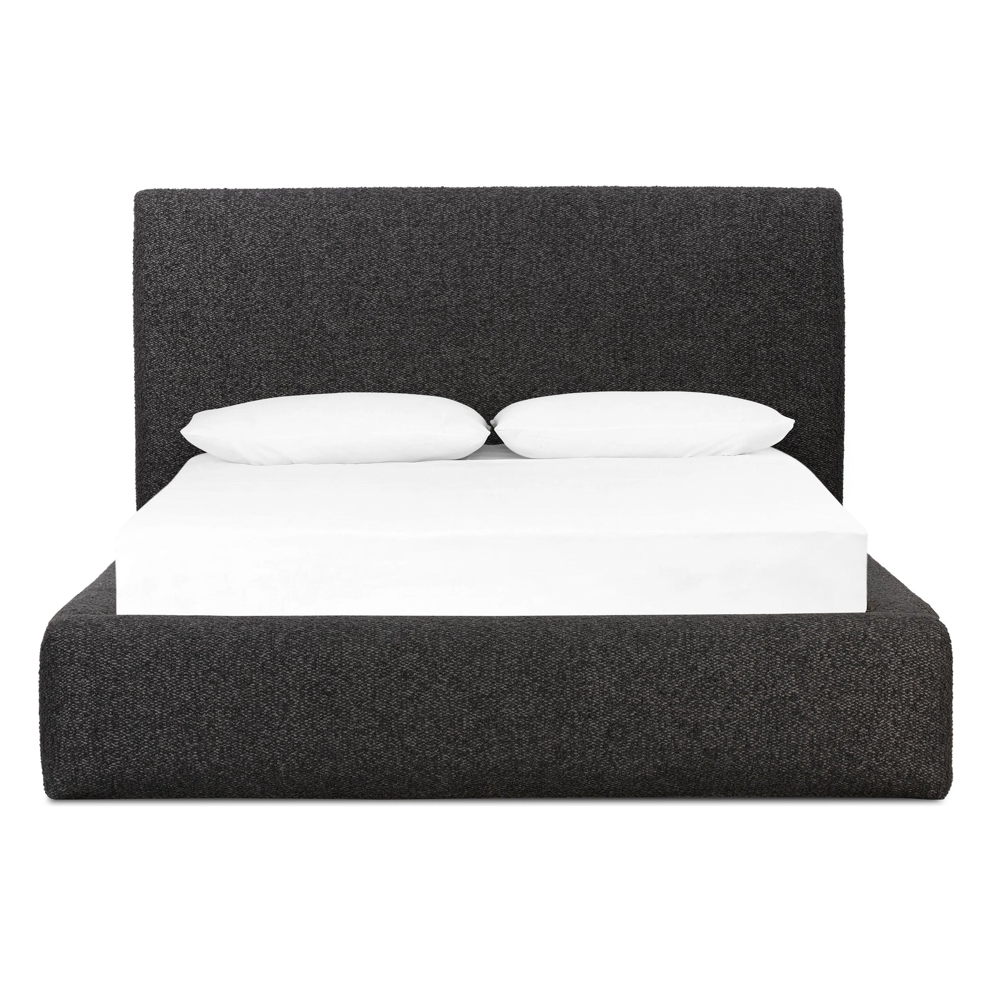 Modern, clean shaping meets inflated comfort with this padded, upholstered bed frame in a textural boucle-like pattern Amethyst Home provides interior design, new home construction design consulting, vintage area rugs, and lighting in the Scottsdale metro area.