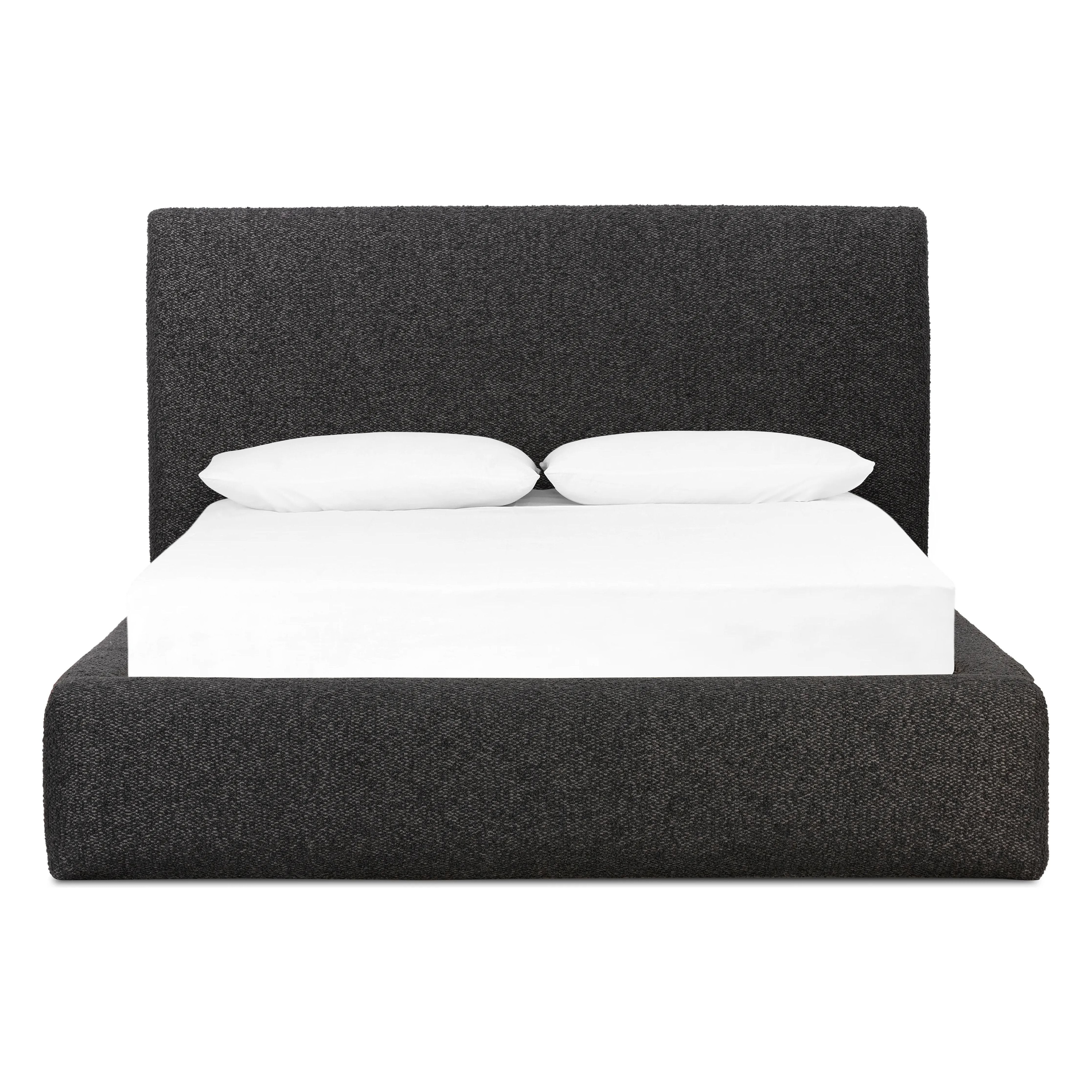 Modern, clean shaping meets inflated comfort with this padded, upholstered bed frame in a textural boucle-like pattern Amethyst Home provides interior design, new home construction design consulting, vintage area rugs, and lighting in the Scottsdale metro area.